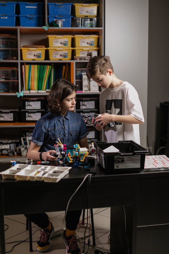 Teenagers Assembling Lego Education Robots 